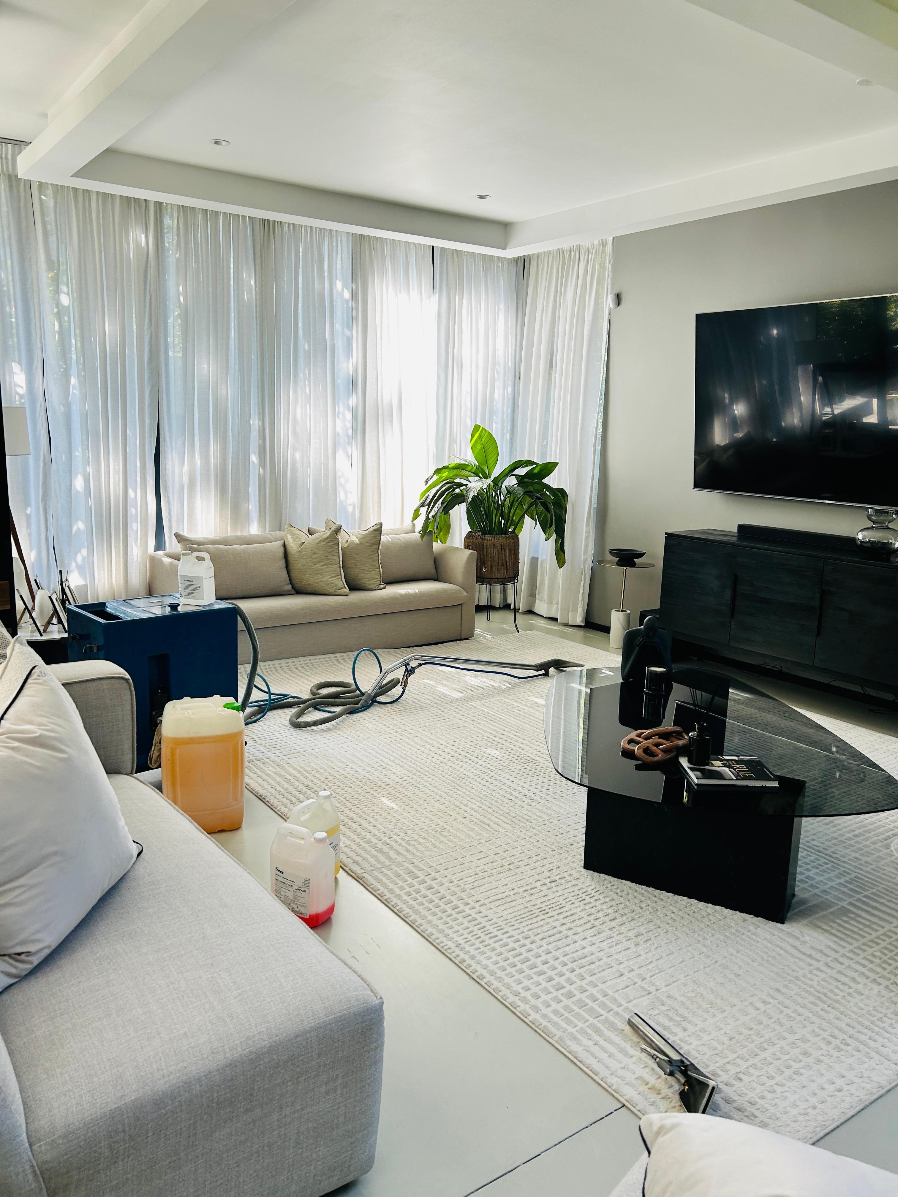Professional carpet cleaning in a modern Johannesburg lounge by Swedan Clean Services